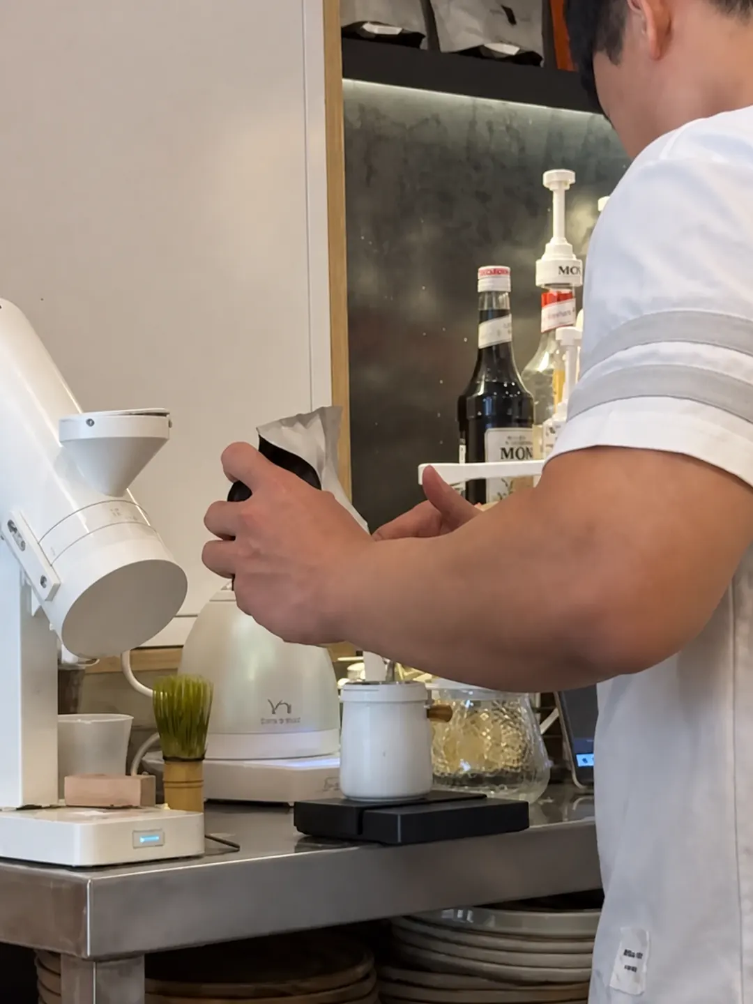 Barista preparing a drink at the Despacito counter
